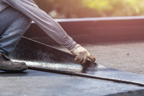 Professional Waterproofing technician working in Livingston, AL
